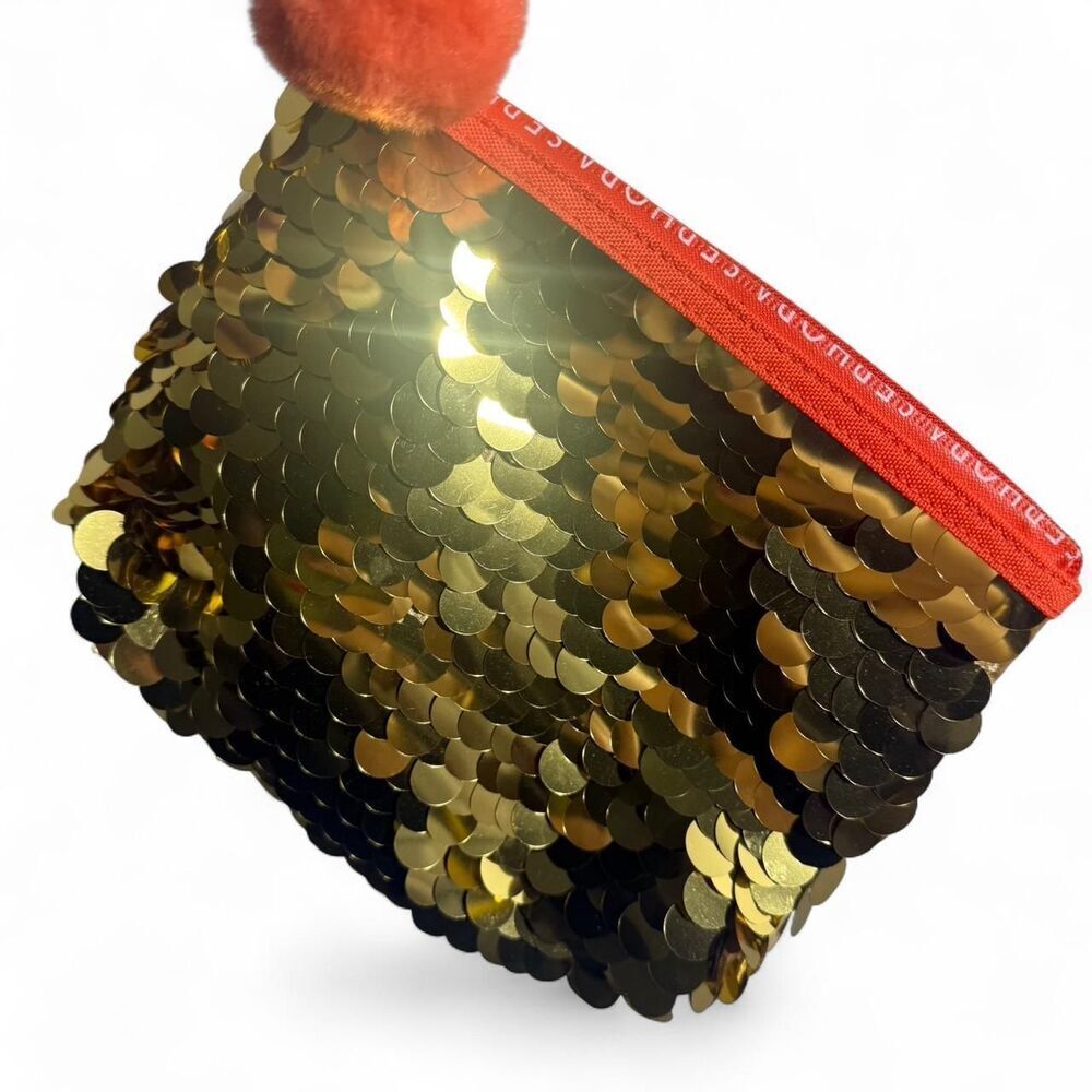 Sephora Gold sequin pouch with orange pom pom